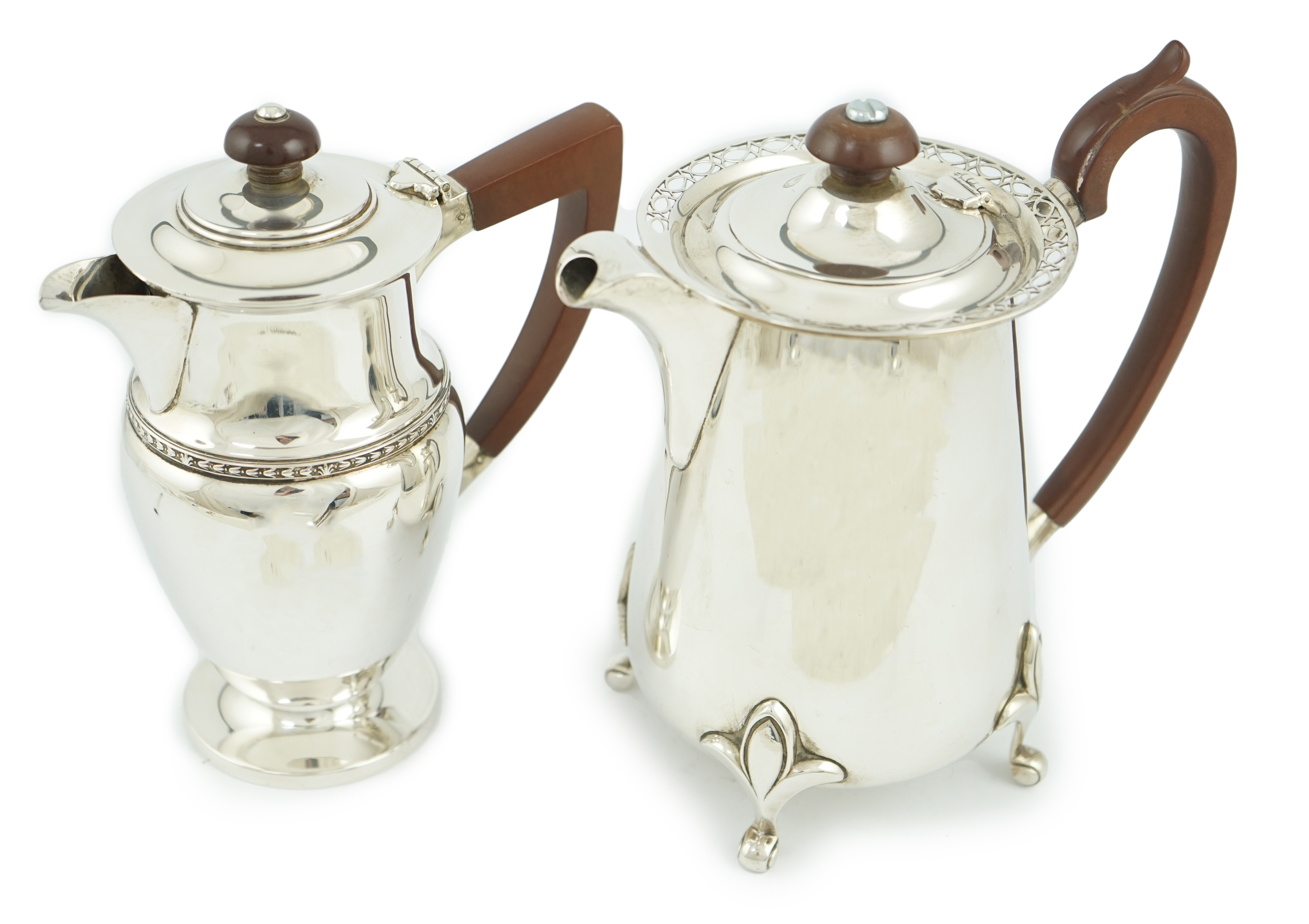 A George V silver hot water pot by Walker & Hall, Sheffield, 1925, and one other silver hot water pot by Albert Edward Jones, Birmingham, Birmingham, 1933